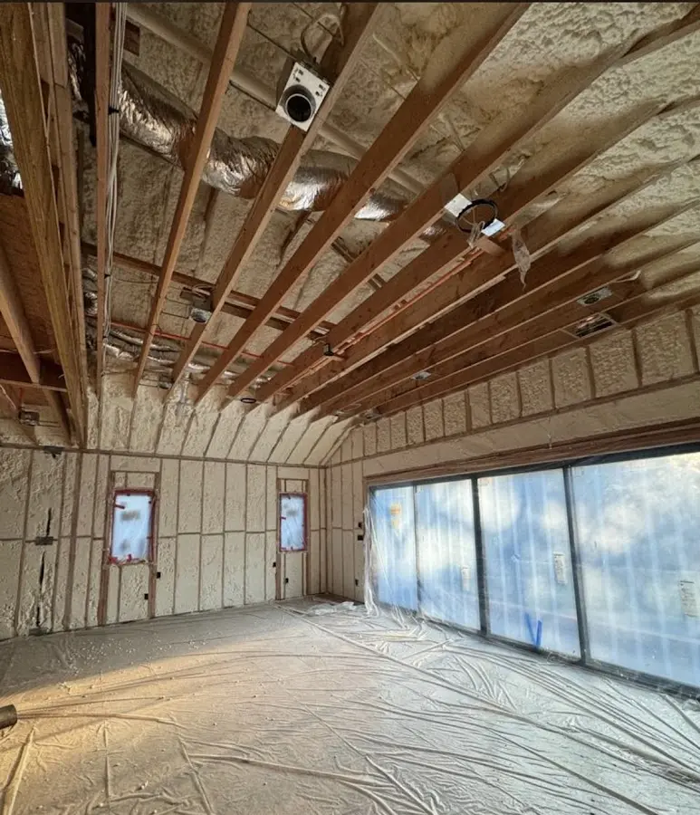 Interior walls and ceiling insulated with spray foam during new construction in Cherry Hills Village